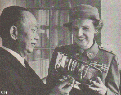 Philippine General Carlos Romulo presents Lt. Col. Ruby Bradley with the U.S. Lady of the Year Award