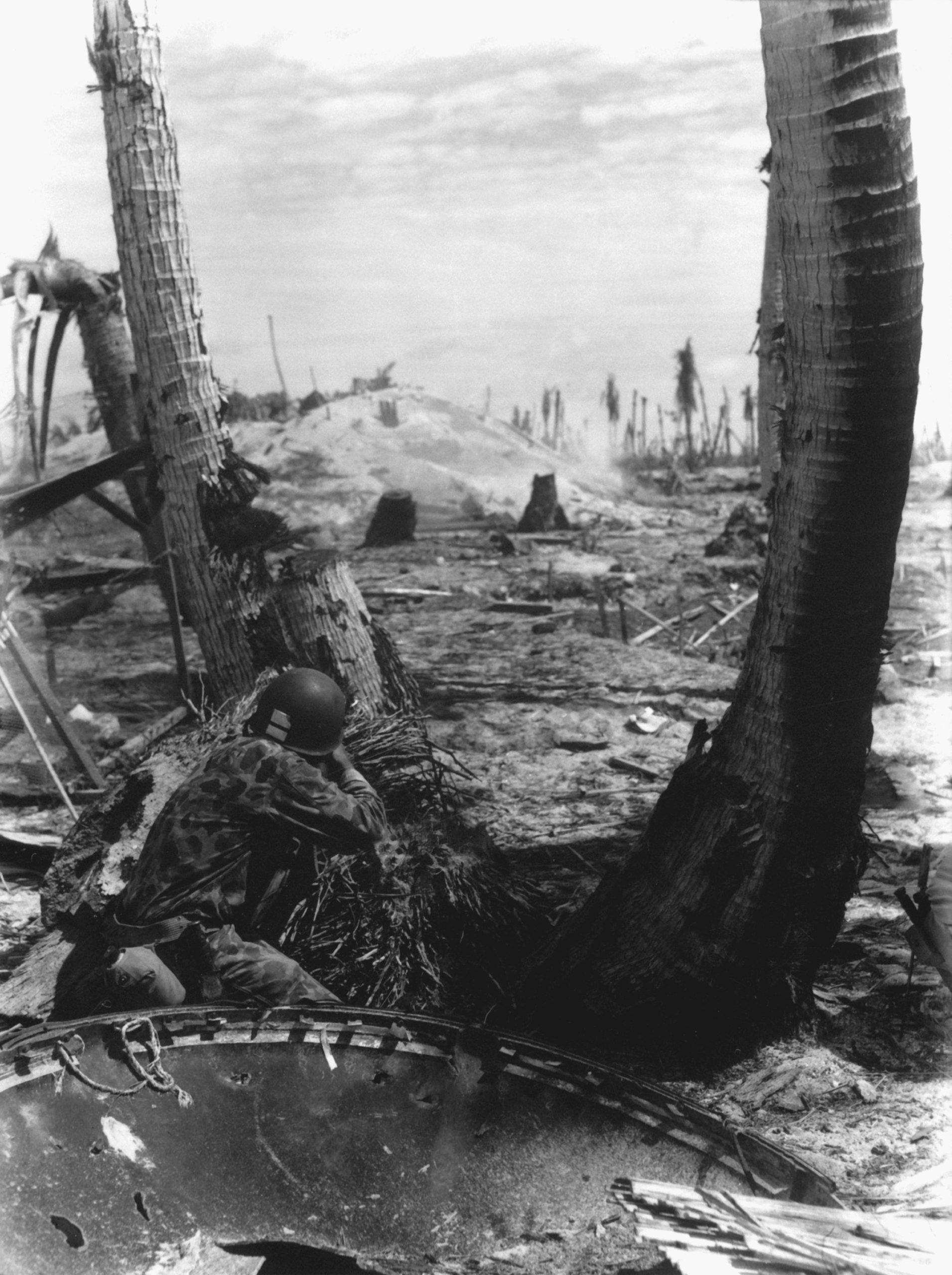 A Marine fires on a Japanese pillbox. November 1943. Image courtesy of US Navy.