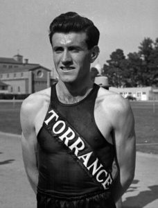 Zamperini wearing a Torrance High School track uniform, 1938.
