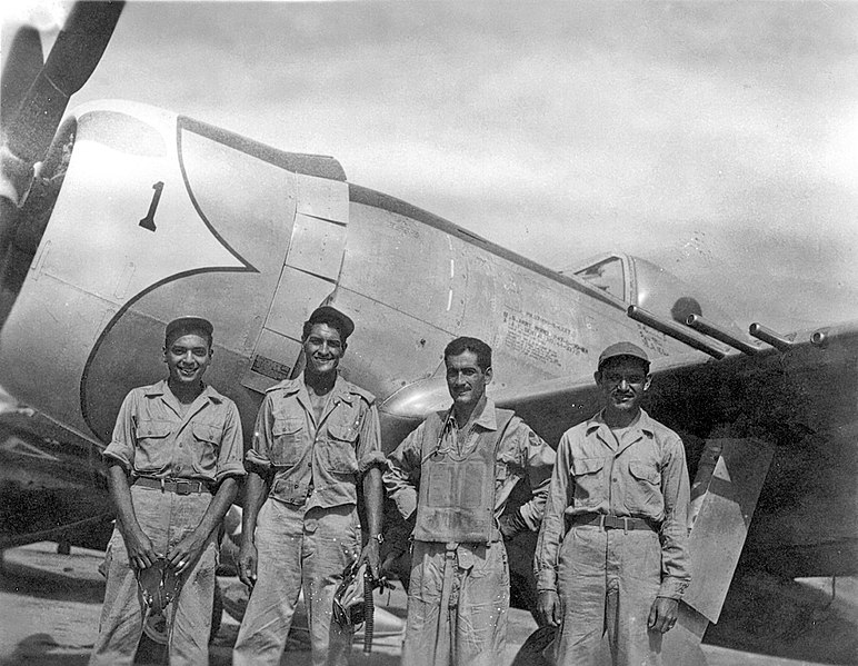 Capt. Radamés Gaxiola stands in front of his P-47D with his maintenance team after he returned from a combat mission.