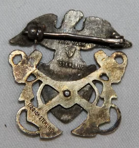 A U.S. Navy Officer's Garrison cap badge showing the mark.