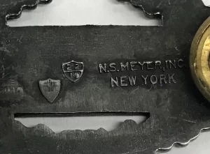 The N.S. Meyer mark on a sterling silver combat infantry badge pin, c. 1950.