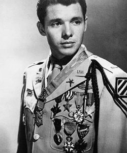 Audie Murphy photographed in 1948 wearing the U.S. Army khaki "Class A" (tropical service) uniform with full-size medals. Source: Wikipedia.